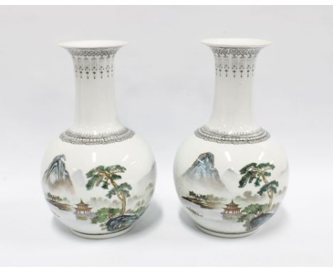 A pair of Chinese Republic Jingdezhen vases, 20th century, handpainted with pagoda and landscape patterns and with calligraph