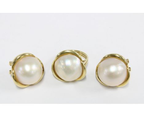 An 18ct gold pearl dress ring, stamped 750, together with matching earrings stamped 585 (3) 