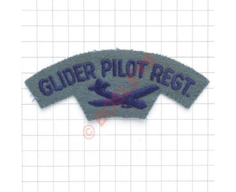 GLIDER PILOT REGT. / glider embroidered cloth shoulder title circa 1950-57. Dark blue on light blue. Removed from uniform. VG