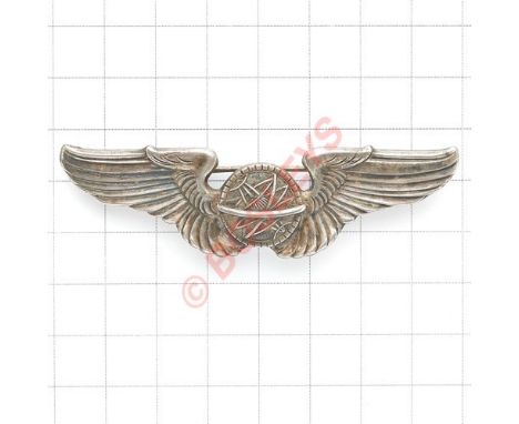 WW2 USAAF Navigator's silver wing. A good die-cast example with central astrolabe. Reverse bears “STERLING” in relief. Brooch