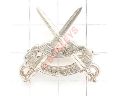 Indian Army. 47th Cavalry scarce WW2 raised Officer’s silver cap badge circa 1941-43. Crossed swords and title scrolls. Rever