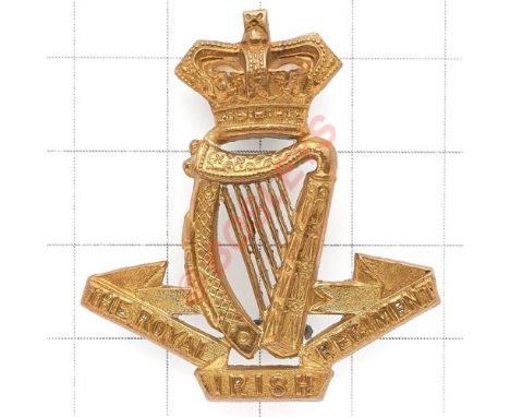 Royal Irish Regiment Victorian OR’s brass cap badge circa 1896-1901. Die-stamped crowned Harp on title scroll. (KK 613) Loops