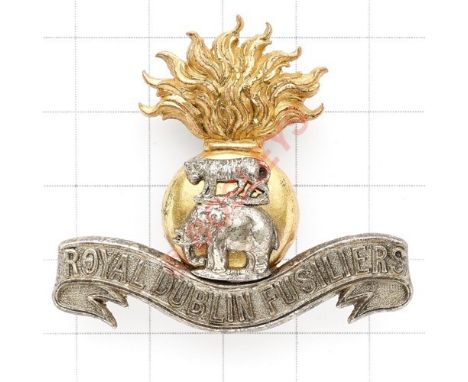 Irish. Royal Dublin Fusiliers Officer’s cap badge circa 1896-1922. Die-cast flaming grenade mounted with silver Tiger and Ele