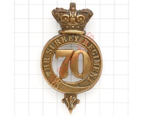 70th (The Surrey) Regiment of Foot OR’s glengarry badge circa 1874-81. Die-stamped brass crowned strap “The Surrey Regiment”;