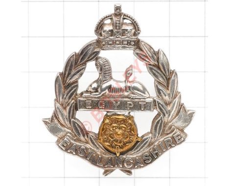 East Lancashire Regiment post 1901 Officer’s cap badge. A very fine die-cast silver example with gilt Rose. J.R. Gaunt London