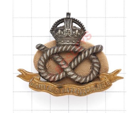 South Staffordshire Regiment Officer’s silvered and gilt cap badge. Reverse impressed “P”. Complete with oval Holland cloth b