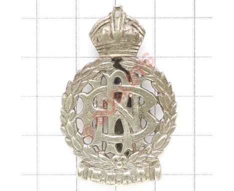 Indian Army. Bengal Nagpur Railway Regiment cap/pagri badge. Crudely cast crowned laurel sprays resting on a scroll inscribed