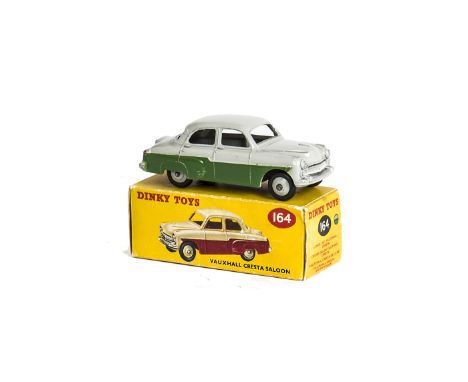 A Dinky Toys 164 Vauxhall Cresta Saloon, dark green lower body, grey upper body and hubs, in original box, E, box F 