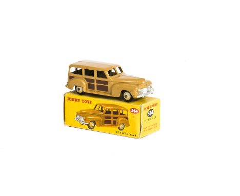 A Dinky Toys 344 Estate Car, tan body, brown panels, cream hubs, in original box, E, a few small chips, box F-G 