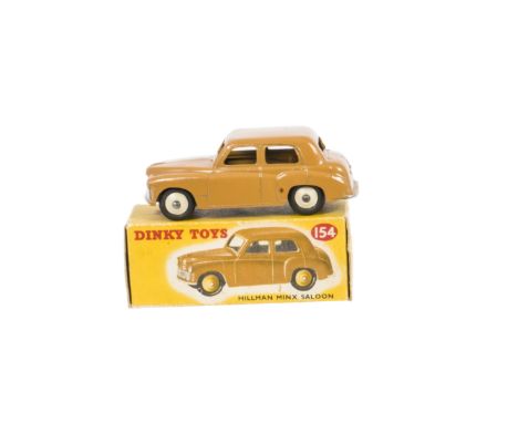 A Dinky Toys 154 Hillman Minx, butterscotch body, cream hubs, in original box, VG-E, box G 