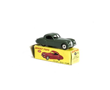 A Dinky Toys 157 Jaguar XK120 Coupe, dark sage green body, spun hubs, in original light yellow box, VG, mark to roof, box F, 