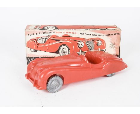 A large scale Tudor Rose Jaguar XK140, in red polythene  with friction drive, in original box, length 12in., E, box G-VG some