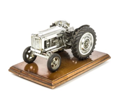 A Chrome Plated Presentation Chad Valley Fordson Major Tractor, static model mounted on wooden plinth, G-VG, some tarnishing 