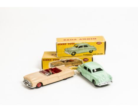 A Dinky Toys 132 Packard Convertible, tan body, red interior and hubs, 172 Studebaker Land Cruiser, light green body, mid-gre