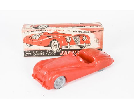 A large-scale  Tudor Rose Jaguar XK140, in red polythene  with friction drive, in original box, length 12in., E, box G-VG, so