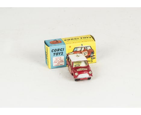 A Corgi Toys 317 Monte-Carlo B.M.C Mini-Cooper 'S', red body, white roof, yellow interior, RN37, roof spotlight, spun hubs, i