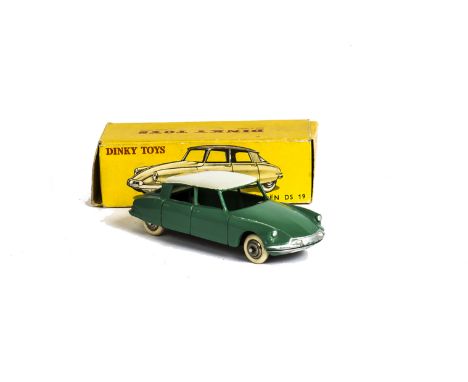 A French Dinky Toys 24c Citroen DS19, green body, white roof, convex hubs, in original box, E, minor bumper wear, box F-G 