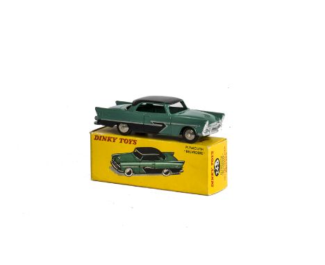 A French Dinky Toys 24d Plymouth Belvedere, green body, black roof and side flash, plated convex hubs, in original box, E, bo