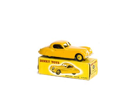 A Dinky Toys 157 Jaguar XK120 Coupe, yellow body, light yellow hubs, in original box, E, a few minor chips to bumper, box F, 