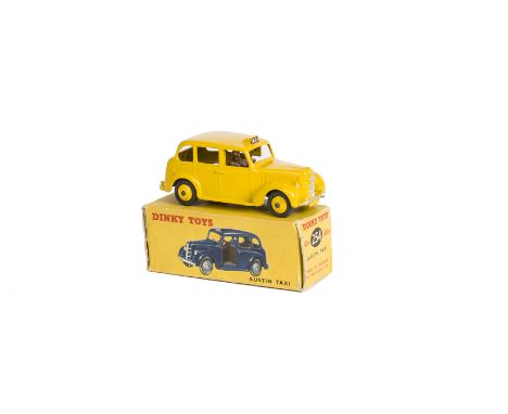 A Dinky Toys 40h/254 Austin Taxi, yellow body and hubs, brown interior, in dual numbered box, VG-E, box P, lacks inner tab 