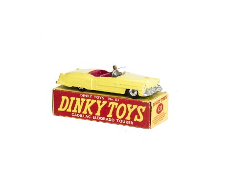 A Dinky Toys 131 Cadillac Eldorado Tourer, yellow body, cerise interior, grey driver, spun hubs, in original box, VG, some re