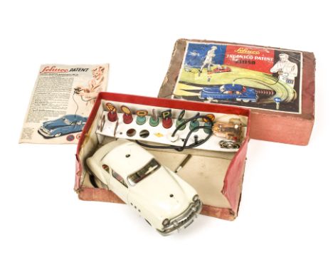 A Schuco 5311SB Tinplate Battery Operated Ingenico Car, light grey body, detailed tinprinted interior, with steering wheel, w