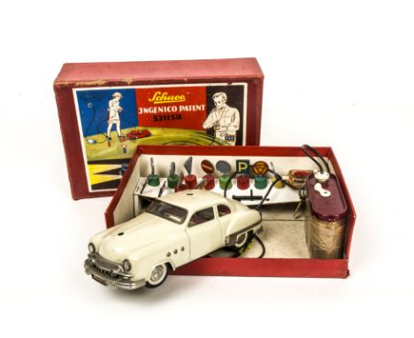 A Schuco 5311SB Tinplate Battery Operated Ingenico Car, light grey body, detailed tinprinted interior, with steering wheel, w