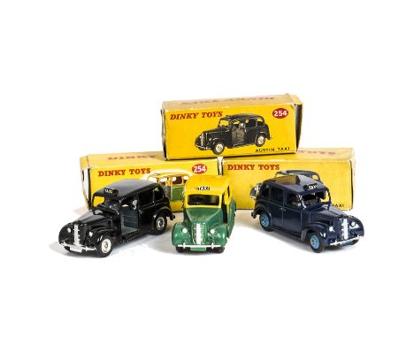 Dinky Toys 40h/254 Austin Taxis, three examples, first two-tone issue, yellow upper body and hubs, dark green lower body, sec