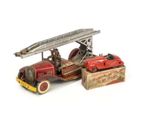 A Mettoy Tinplate Clockwork Fire Engine, large scale model with three firemen and extending ladder, marked 'Made In England' 