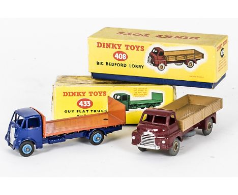 Dinky Toys 433 Guy Flat Truck With Tailboard, 2nd type violet-blue cab and chassis, orange flatbed, mid-blue grooved hubs, 40