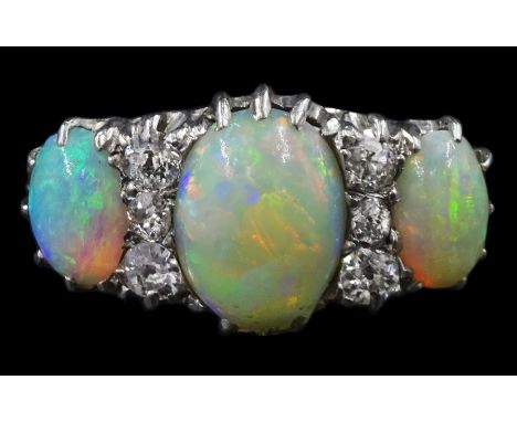 Early 20th century 18ct white gold three stone opal and six stone old cut diamond ring, in velvet and silk lined leather box 