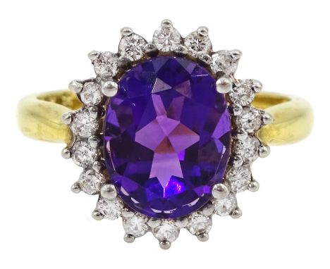 18ct gold oval amethyst and round brilliant cut diamond cluster ring, hallmarkedCondition Report:Approx 4.05gm, size J, overa