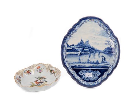 EARLY 20TH CENTURY DUTCH DELFTWARE BLUE &amp; WHITE WALL PLAQUE, of shaped oval form, hand-painted with a scene of children i