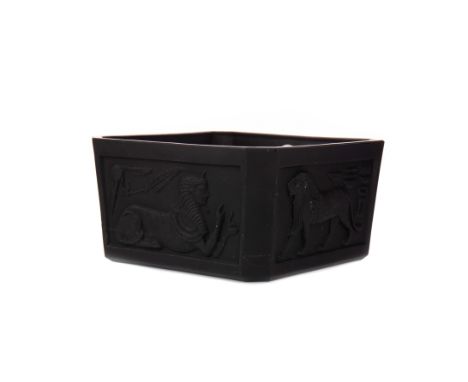EGYPTIAN REVIVAL BLACK GLASS PLANTER, of square form, decorated with panels of Sphinx and lions in relief, 15.5cm wide