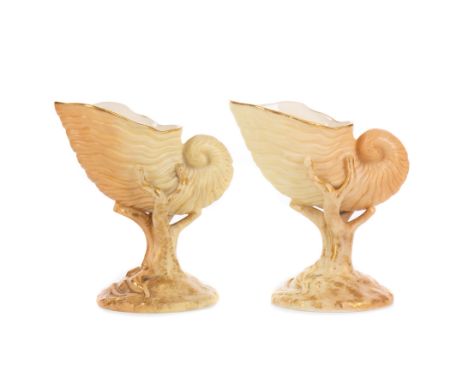 TWO SMALL ROYAL WORCESTER NAUTILUS VASES, the bases moulded with coral and shells, one with green transfer mark and dot code 