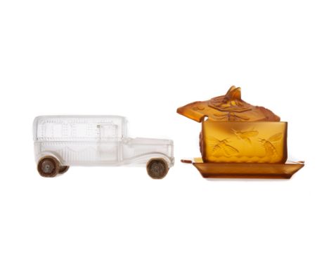 EARLY 20TH CENTURY AMBER GLASS PRESERVE JAR, COVER AND STAND, of square section form, moulded in relief with bees, 21cm wide,