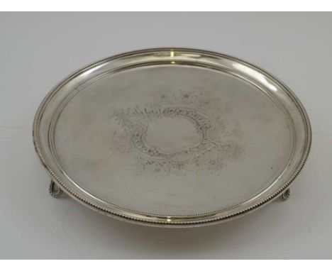 HENRY CHAWNER AN 18TH CENTURY SILVER SALVER with beaded border, chased decorated blind cartouche, London 1786, 20.5cm in diam