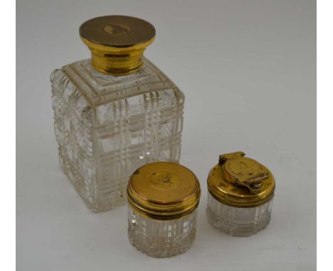 THOMAS DILLER THREE CUT GLASS APPOINTMENTS WITH SILVER GILT LIDS, a toilet water bottle, a rouge jar and a travelling inkwell