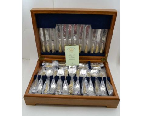 DAVENPORT &amp; SULLIVAN A MAHOGANY CANTEEN OF SILVER-PLATED AND PARCEL GILT CUTLERY for six settings, hinged lid of canteen 