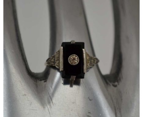 A LADY'S GOLD &amp; SILVER DRESS RING, inset rectangular black stone, possibly jet, ring size; "P1/2" 