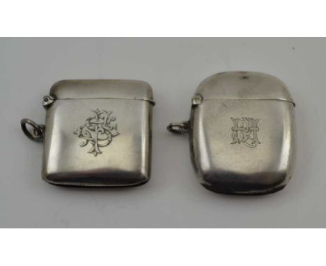 TWO PLAIN SILVER VESTAS, both monogrammed, one London 1896, the other Birmingham 1903, both with suspension rings, combined w