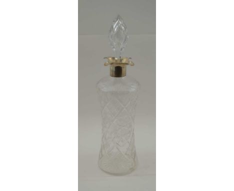 ELKINGTON &amp; CO. A CUT GLASS DECANTER, with silver collar and four pouring lips, London 1906, fitted cut steeple stopper 