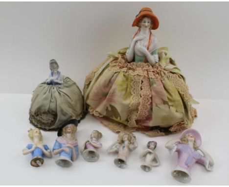 A COLLECTION OF EARLY 20TH CENTURY CERAMIC HALF-DOLLS, two mounted to fabric crinoline skirts, the tallest 23cm high, togethe