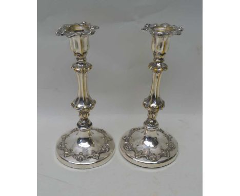 A PAIR OF SILVER PLATED CANDLESTICKS, 24.5cm high 