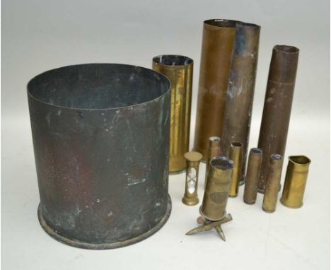 TWELVE BRASS SHELL CASES of various dimensions, one fashioned as trench art, with "Ypres" panel, 14cm high, together with A B