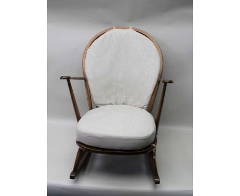 AN ERCOL ROCKING CHAIR, with upholstered seat &amp; back cushions 