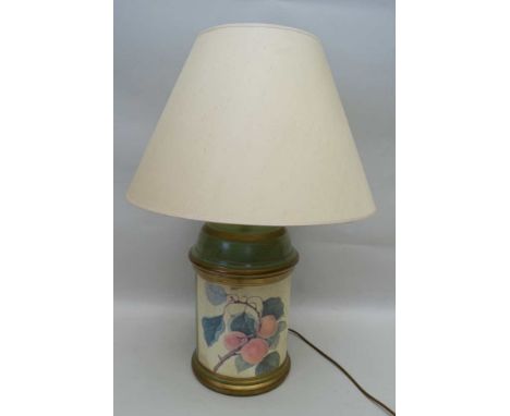 A POTTERY TABLE LAMP of cylinder form, pale green ground with fruit decoration, with fitted plain cream shade, overall height