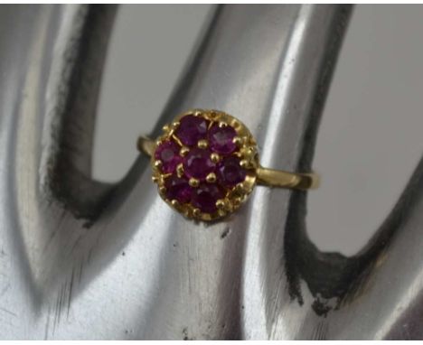 A LADY'S 14K GOLD DRESS RING, inset ruby cluster, ring size; "N" 