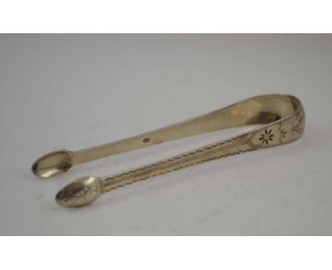 A PAIR OF GEORGIAN SILVER SUGAR TONGS with bright cut decoration, Exeter, weight; 39g 