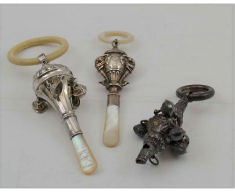 WILLIAM ADAMS LTD A SILVER CHILD'S RATTLE, having embossed elephant head decoration, with mother of pearl teether, Birmingham